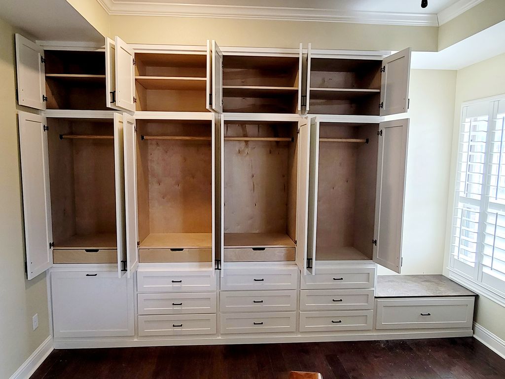 The same closet wall with doors open, showing shelving and hanging space